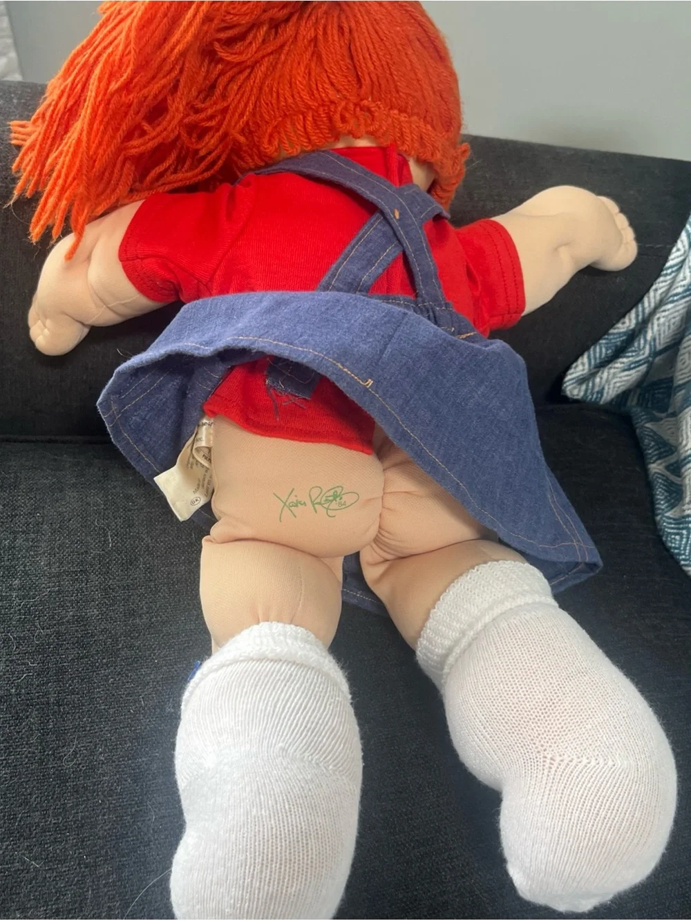 Orange-Haired  Cabbage Patch  Kids Doll with Blue Eyes has tooth retainers